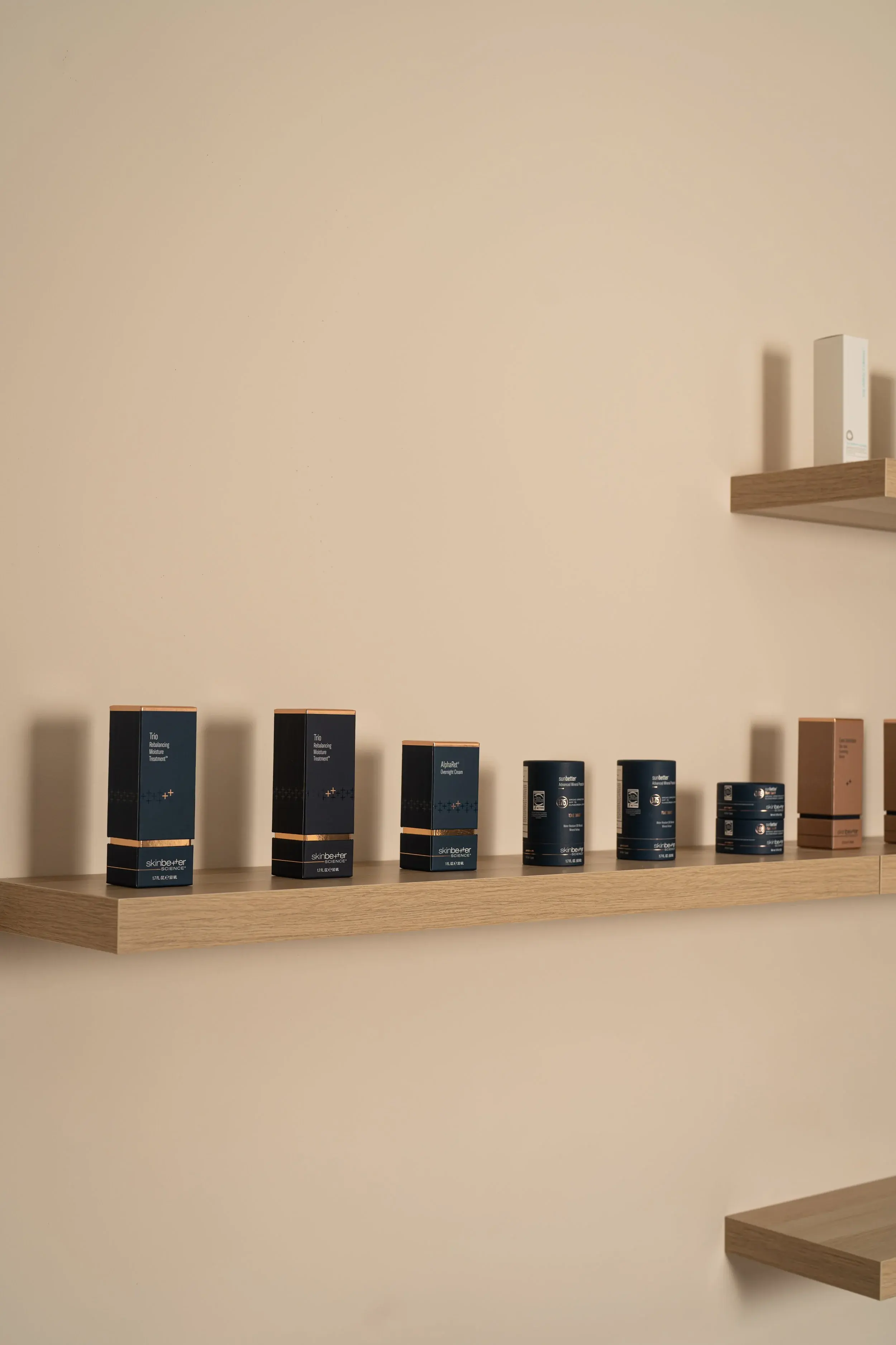skinbetter science boxes arranged on a shelf in the studio